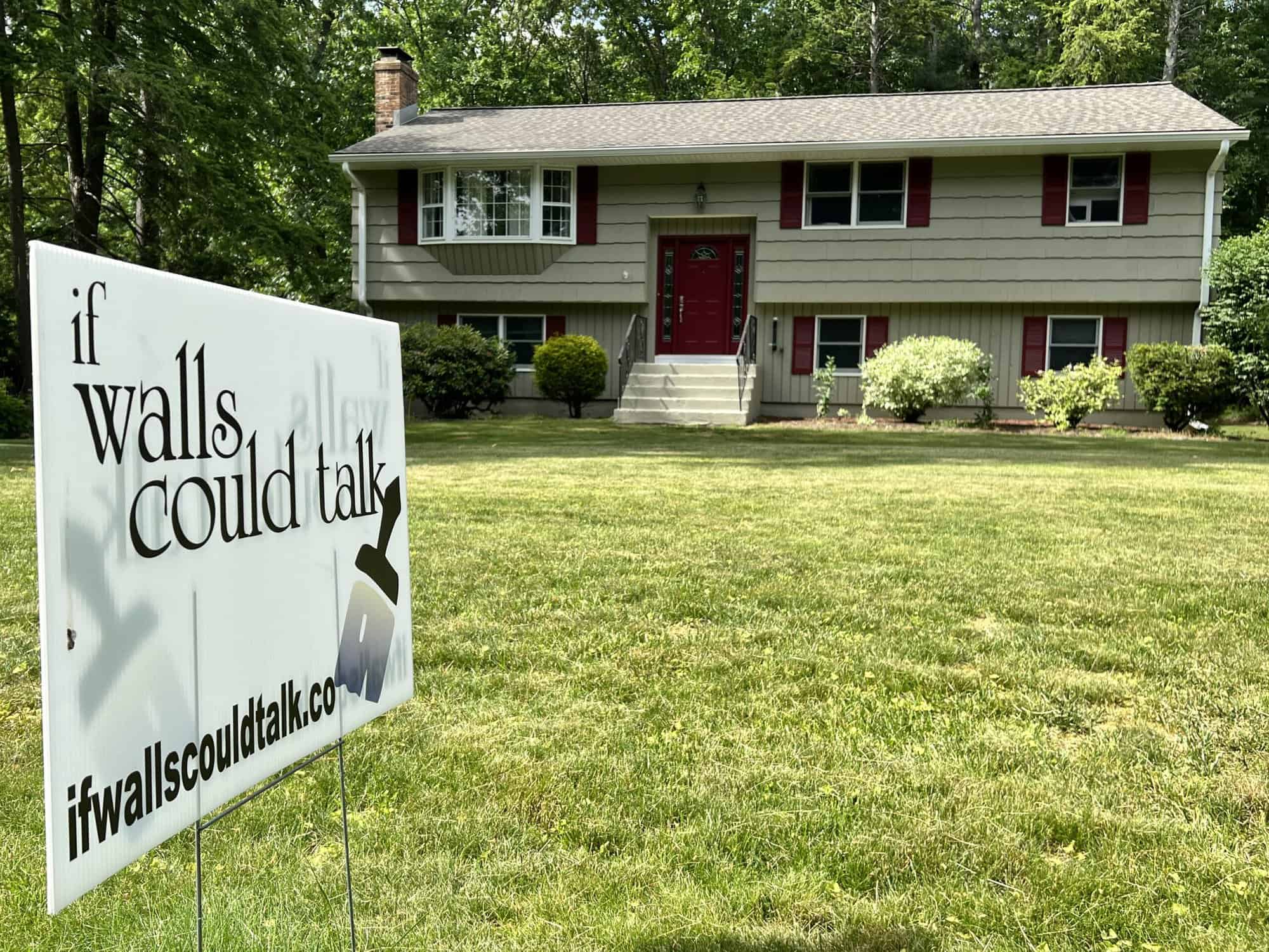 if walls could talk sign outside a house